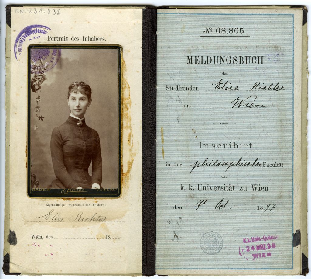 Portrait of a young woman with updo hair wearing a dark long-sleeve dress against a plain background, right page shows registration book of Elise Richter from Vienna, enrolled 1897 at the Faculty of Philosophy, University of Vienna.