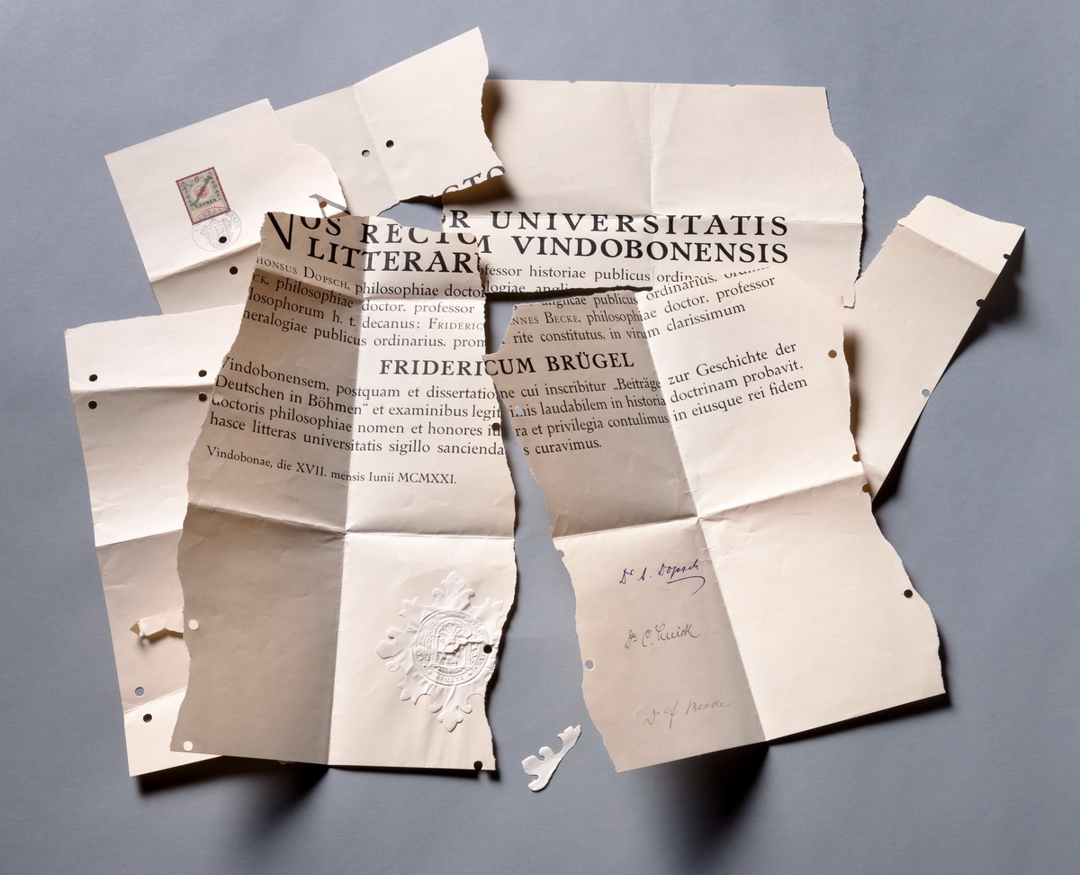 Torn and folded official document with Latin text, handwritten signatures, and embossed seal